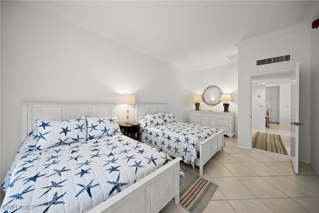 bedroom with light tile patterned floors, visible vents, and crown molding