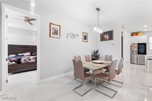 dining space with ceiling fan