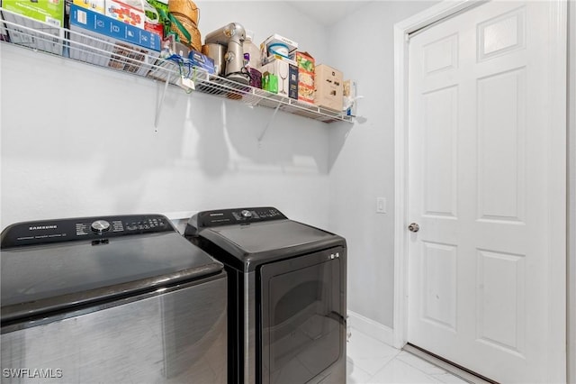 washroom with independent washer and dryer