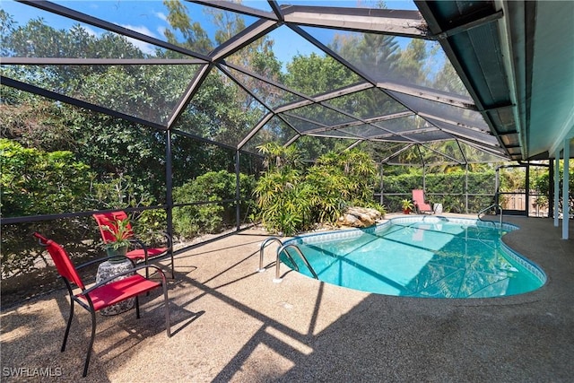 view of pool featuring a lanai and a patio area