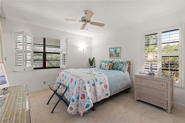 bedroom with light colored carpet and ceiling fan