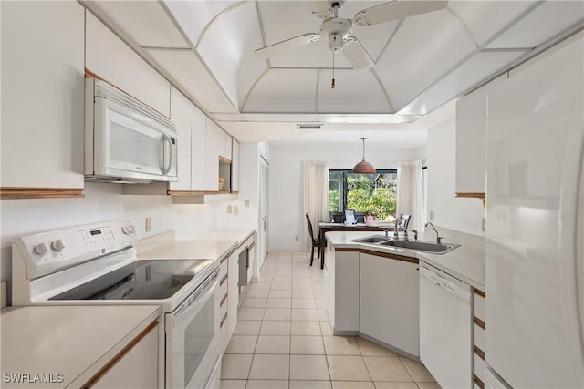 kitchen featuring white appliances, sink, and white cabinets