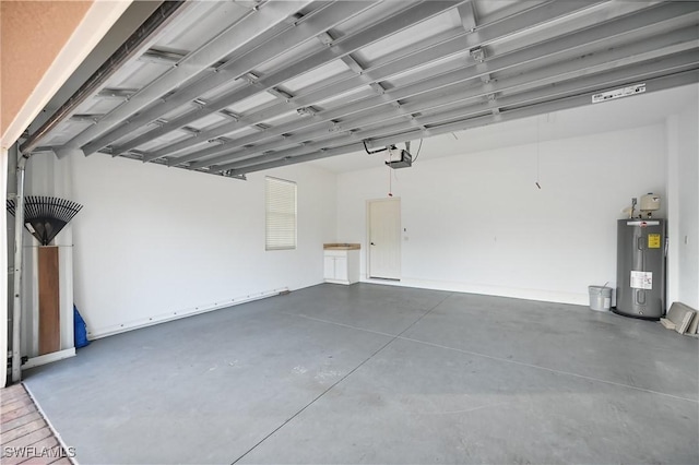 garage featuring water heater and a garage door opener