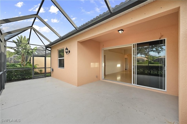 view of patio / terrace featuring glass enclosure