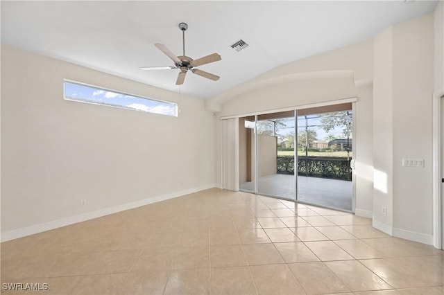 empty room featuring light tile patterned flooring, ceiling fan, and lofted ceiling