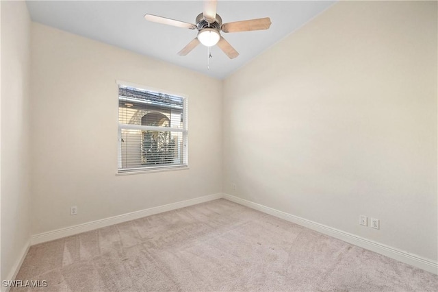 carpeted empty room with ceiling fan