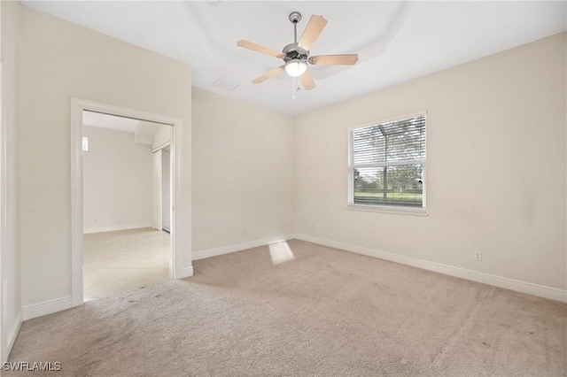 carpeted empty room featuring ceiling fan