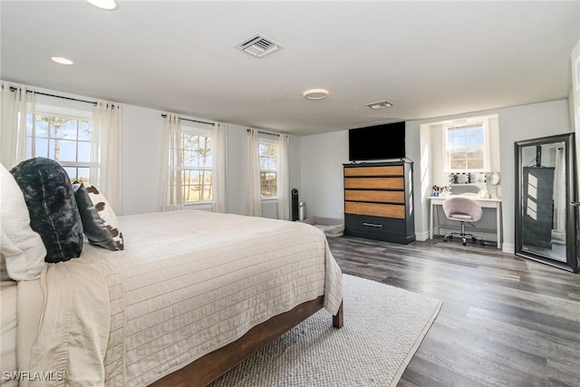 bedroom featuring dark hardwood / wood-style flooring