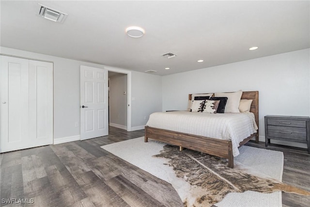 bedroom featuring dark wood-type flooring