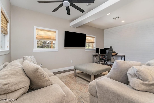 living room featuring ceiling fan and light hardwood / wood-style flooring