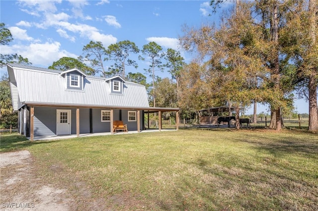 view of front of house featuring covered porch and a front yard