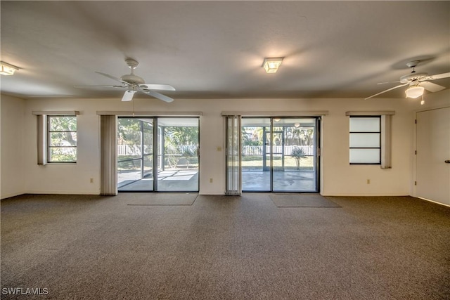 unfurnished room featuring carpet and ceiling fan