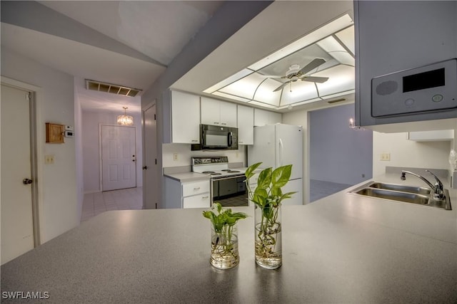 kitchen with ceiling fan, white appliances, sink, and white cabinets