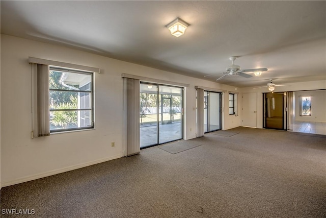 carpeted empty room with ceiling fan