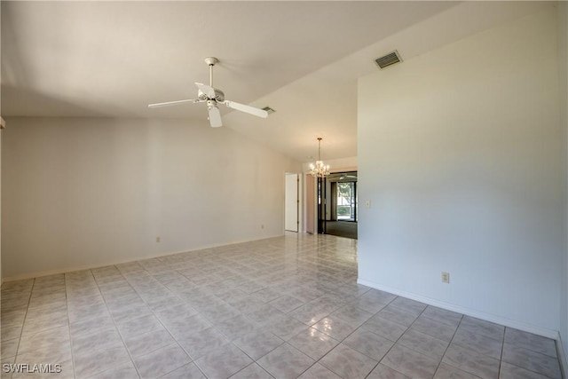 empty room featuring lofted ceiling and ceiling fan with notable chandelier