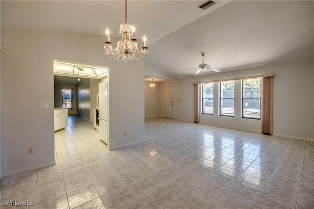 tiled spare room featuring lofted ceiling and ceiling fan with notable chandelier