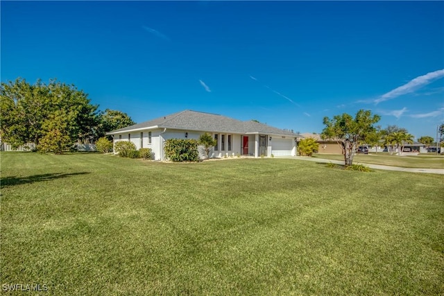 ranch-style home with a garage and a front yard