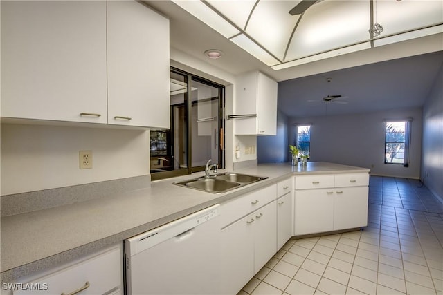 kitchen with sink, white cabinetry, white dishwasher, kitchen peninsula, and ceiling fan