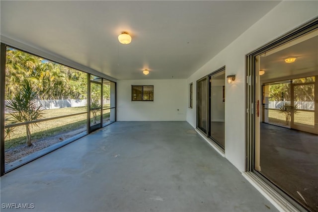 unfurnished sunroom featuring a wealth of natural light