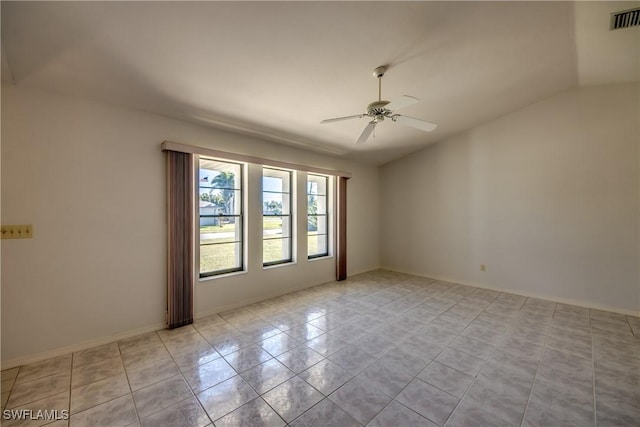 spare room featuring light tile patterned flooring and ceiling fan