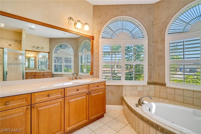 bathroom featuring tile patterned flooring, vanity, and independent shower and bath