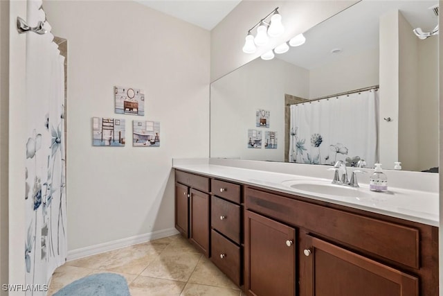 bathroom with vanity, tile patterned floors, and walk in shower