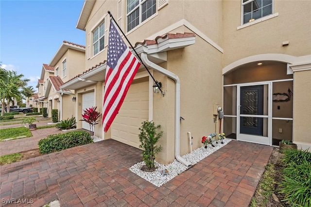 entrance to property featuring a garage