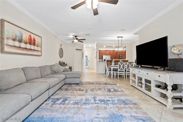 living room featuring ceiling fan, ornamental molding, and light tile patterned floors