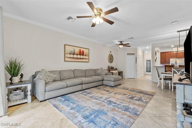 tiled living room featuring crown molding and ceiling fan