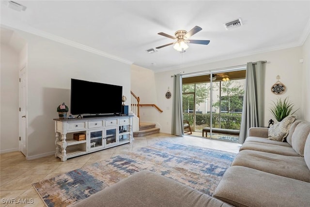 living room with ornamental molding, ceiling fan, and light tile patterned flooring