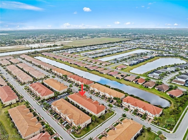 birds eye view of property with a water view