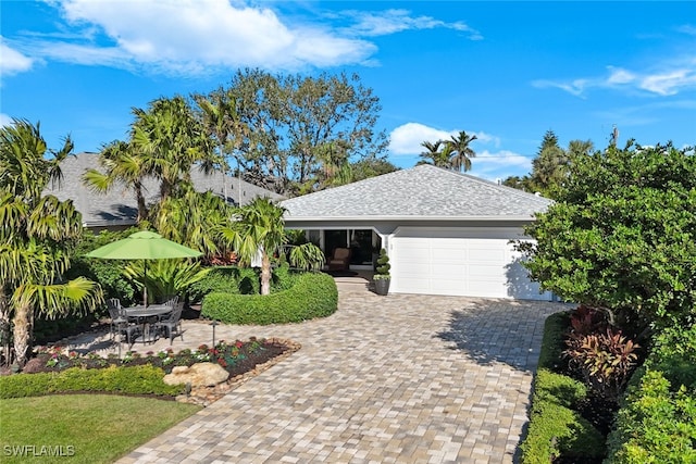 ranch-style house featuring a garage