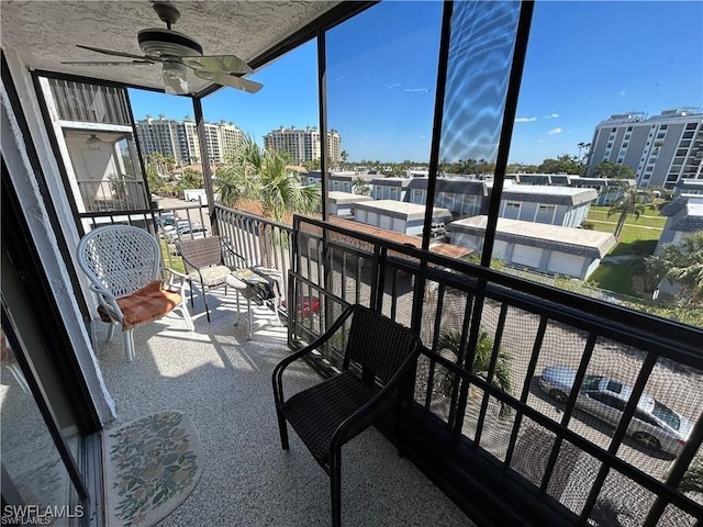 balcony featuring ceiling fan