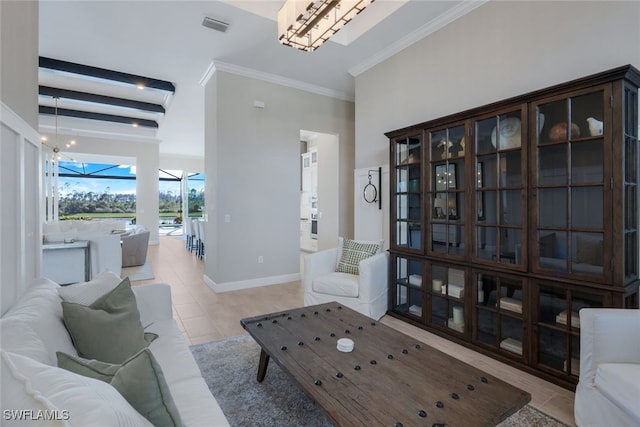 living room featuring beam ceiling, ornamental molding, and light tile patterned flooring