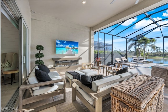 view of patio with outdoor lounge area and glass enclosure