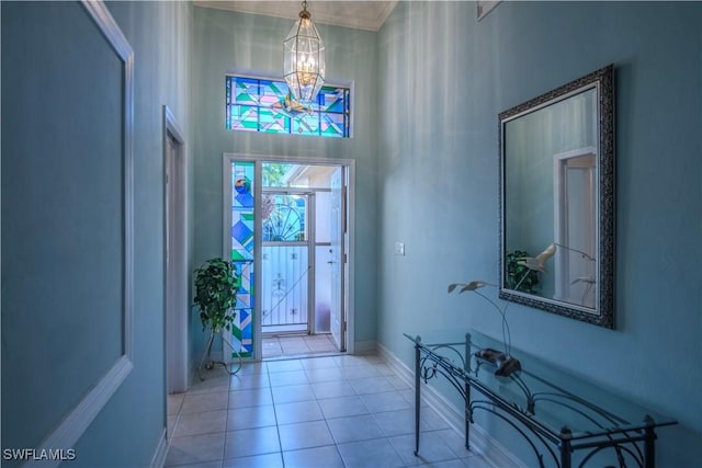 9269 Coach House Ln, Estero, FL 33928 - foyer entrance with baseboards, an inviting chandelier, and tile patterned flooring