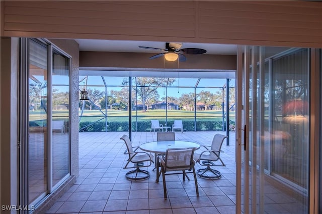 sunroom / solarium with ceiling fan