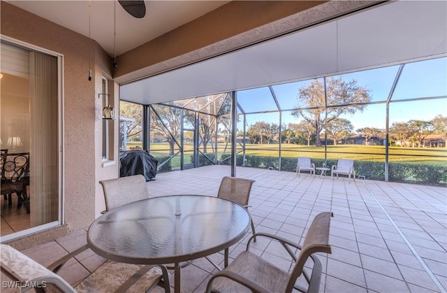 view of patio / terrace featuring a grill, a lanai, and ceiling fan