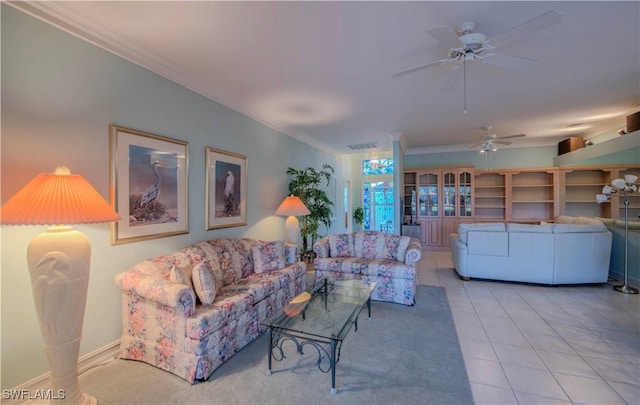 living room featuring crown molding, ceiling fan, and light tile patterned flooring