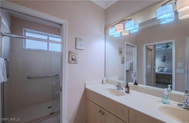 bathroom featuring vanity and a shower with door