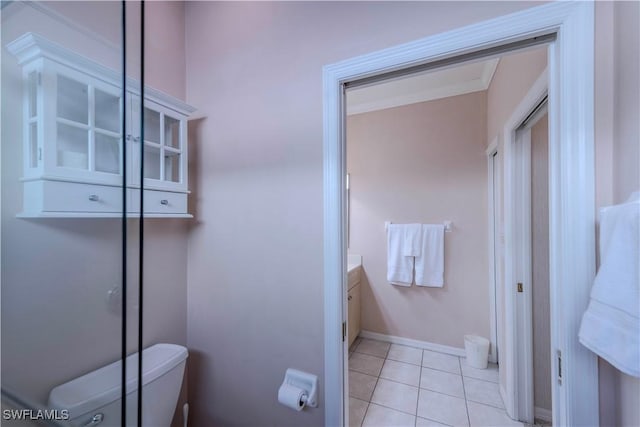 bathroom featuring vanity, tile patterned floors, and toilet