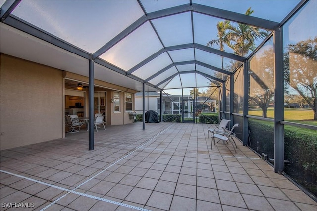 unfurnished sunroom with lofted ceiling