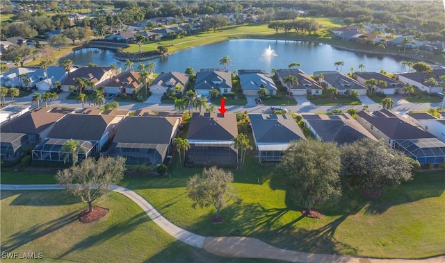 drone / aerial view with a water view