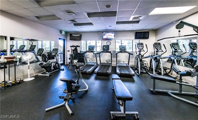9269 Coach House Ln, Estero, FL 33928 - gym with visible vents, a paneled ceiling, and a wealth of natural light