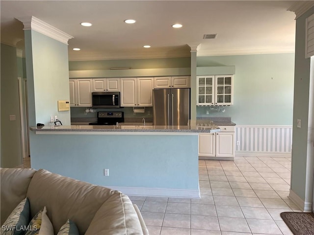 9269 Coach House Ln, Estero, FL 33928 - kitchen featuring visible vents, ornamental molding, stone countertops, appliances with stainless steel finishes, and light tile patterned floors