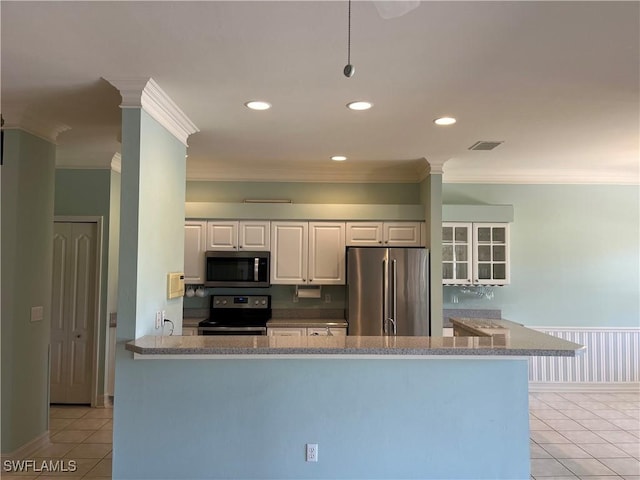 9269 Coach House Ln, Estero, FL 33928 - kitchen with crown molding, appliances with stainless steel finishes, light tile patterned floors, and white cabinets