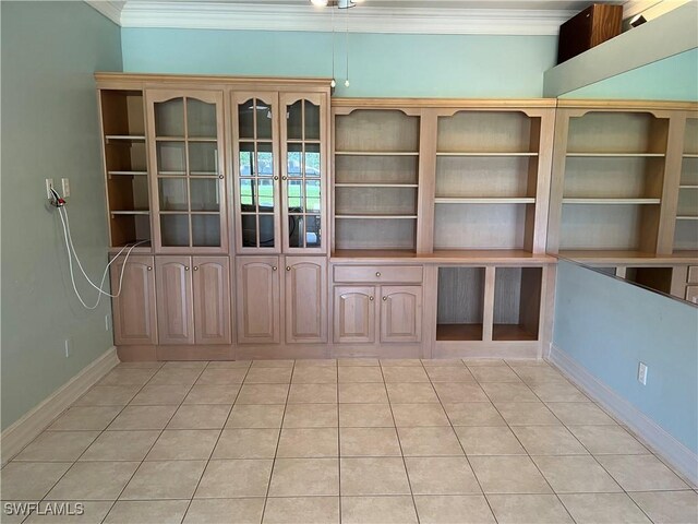 9269 Coach House Ln, Estero, FL 33928 - empty room featuring crown molding, baseboards, and light tile patterned floors