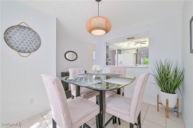 dining room with light tile patterned flooring