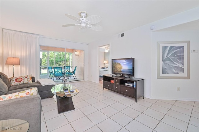 tiled living room featuring ceiling fan