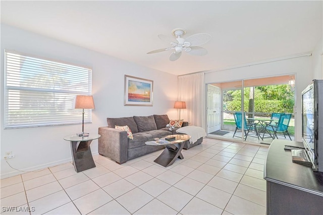 living room with light tile patterned floors and ceiling fan